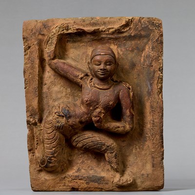 Lot 380 - PROBABLY A YAKSHI (NATURE SPIRIT) IN RELIEF EASTERN INDIA, 11TH–12TH CENTURY