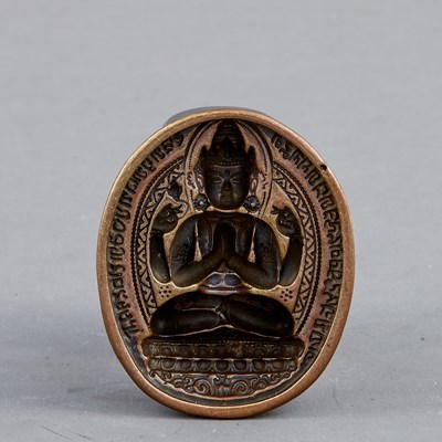 Lot 104 - FOUR-ARMED AVALOKITESHVARA TSATSA MOLD, TIBET, 16TH CENTURY