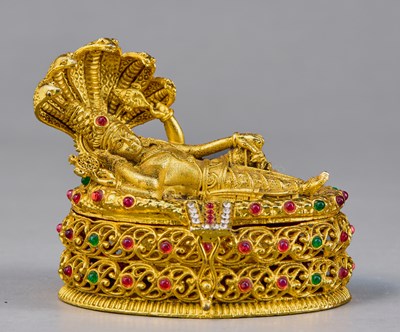 Lot 105 - RECLINING VISHNU BRASS WITH SEMI PRECIOUS STONES INDIAN 20TH CENTURY