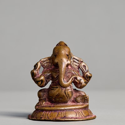 Lot 363 - SEATED GANESHA, CAST BRONZE WITH TRACES OF POLYCHROMY, NEPAL, 15TH–16TH CENTURY