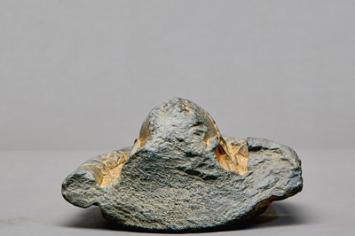 Lot 9 - STONE HEAD OF A BUDDHA WITH ATTENDANT ELEPHANTS, KASHMIR REGION, 4TH–5TH CENTURY