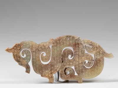 Lot 93 - CHINESE DRAGON-SHAPED JADE PENDANT WITH CIRRUS CLOUD STRIPES THE WARRING STATES (475-221 BC)