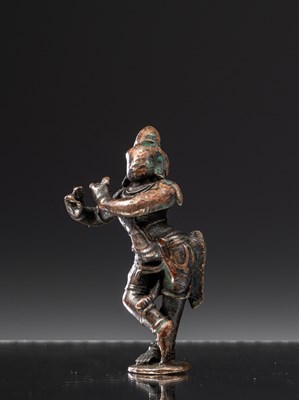 Lot 214 - KRISHNA PLAYING THE FLUTE